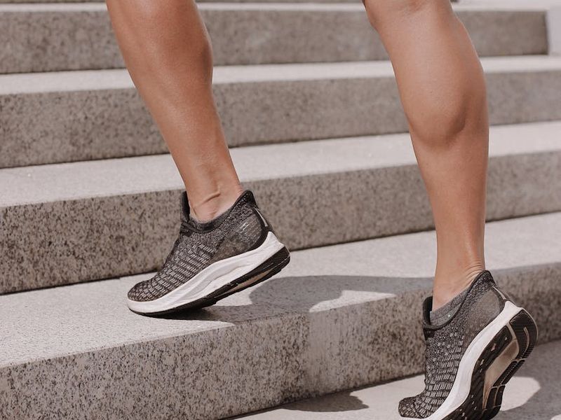 A person in mid-motion during a fluid cardio exercise.